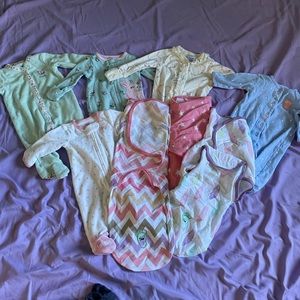 5 carters footies and 3 Velcro swaddles